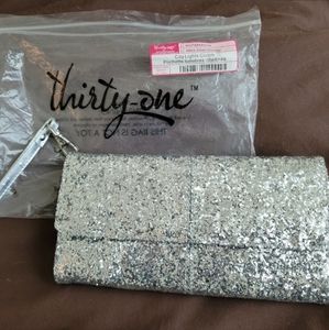 31 city lights silver glitter clutch. Brand new.
